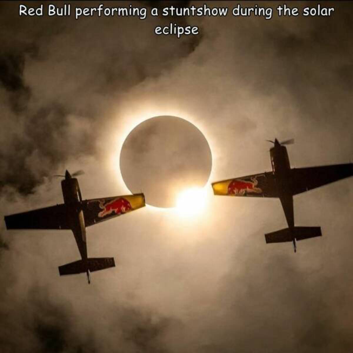 Solar eclipse - Red Bull performing a stuntshow during the solar eclipse