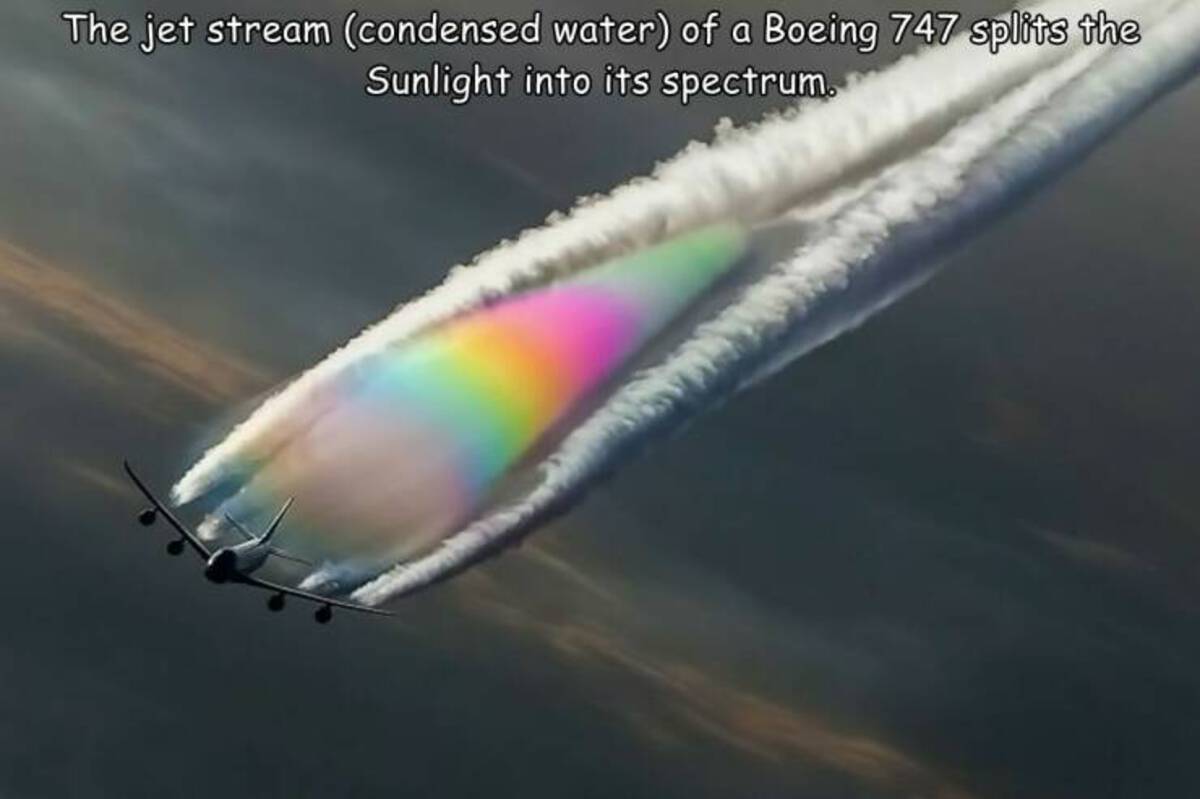 rainbow contrails - The jet stream condensed water of a Boeing 747 splits the Sunlight into its spectrum.