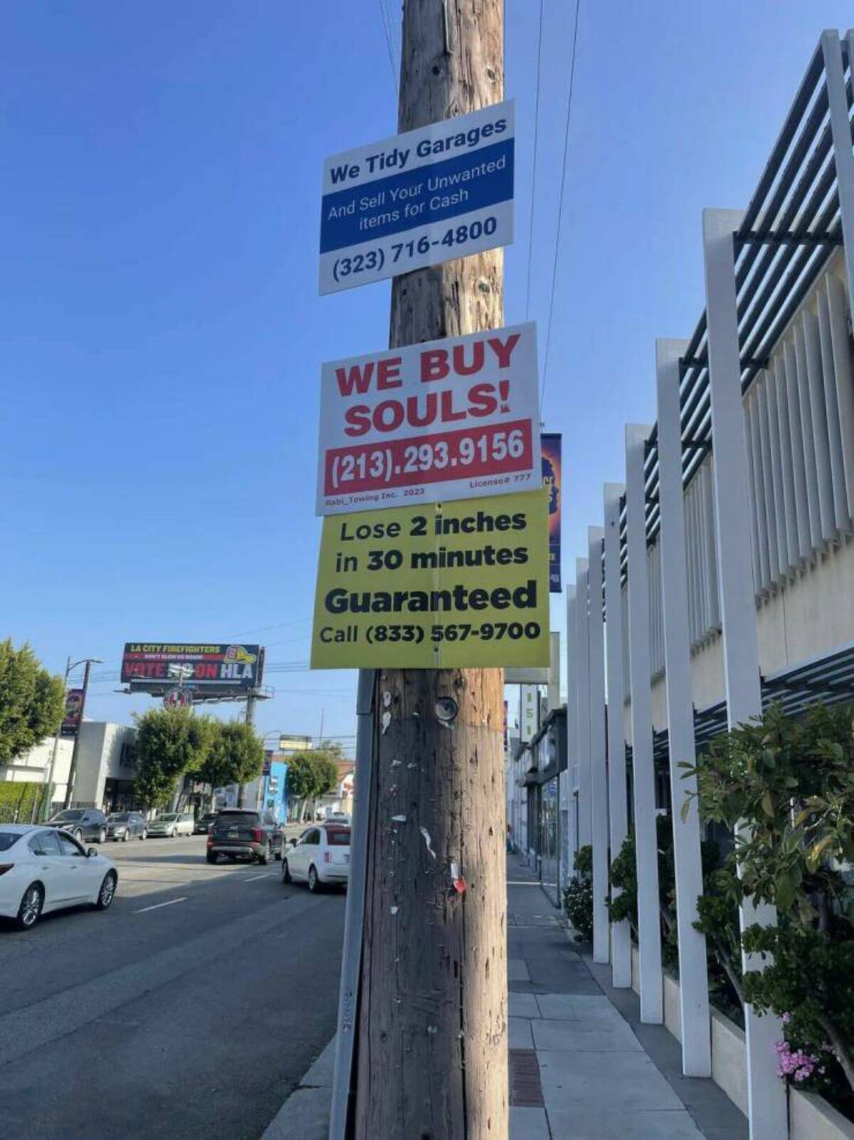 street sign - We Tidy Garages And Sell Your Unwanted items for Cash 323 7164800 La City Firefighters Vote Ns On Hla We Buy Souls! 213.293.9156 Rabi Towing Inc. 2023 License 777 Lose 2 inches in 30 minutes Guaranteed Call 833 5679700