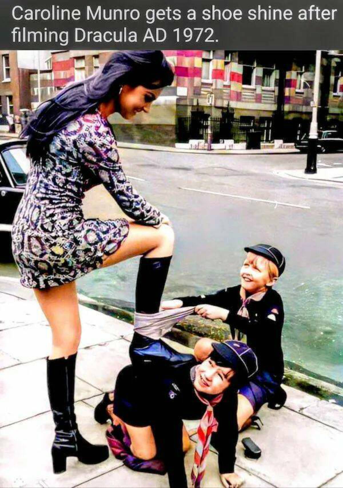 caroline munro shoe shine - Caroline Munro gets a shoe shine after filming Dracula Ad 1972.