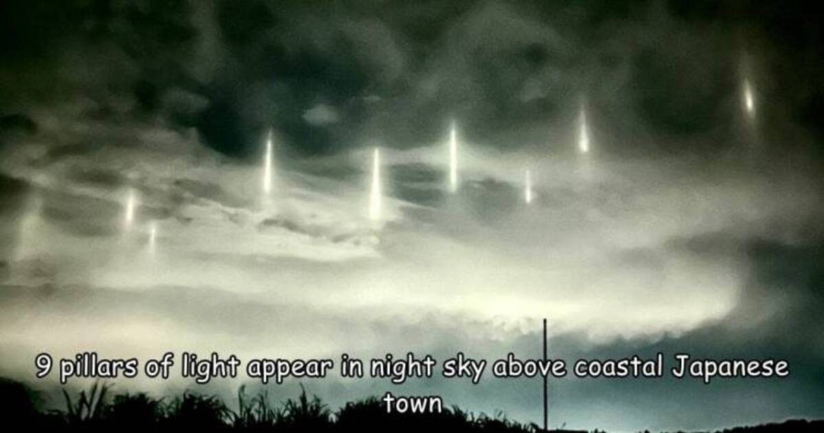 Light pillar - 9 pillars of light appear in night sky above coastal Japanese town