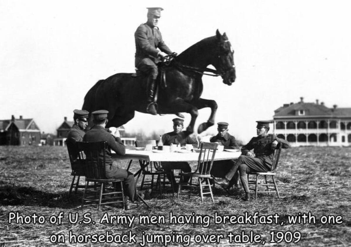 Photo of U.S. Army men having breakfast, with one on horseback jumping over table, 1909