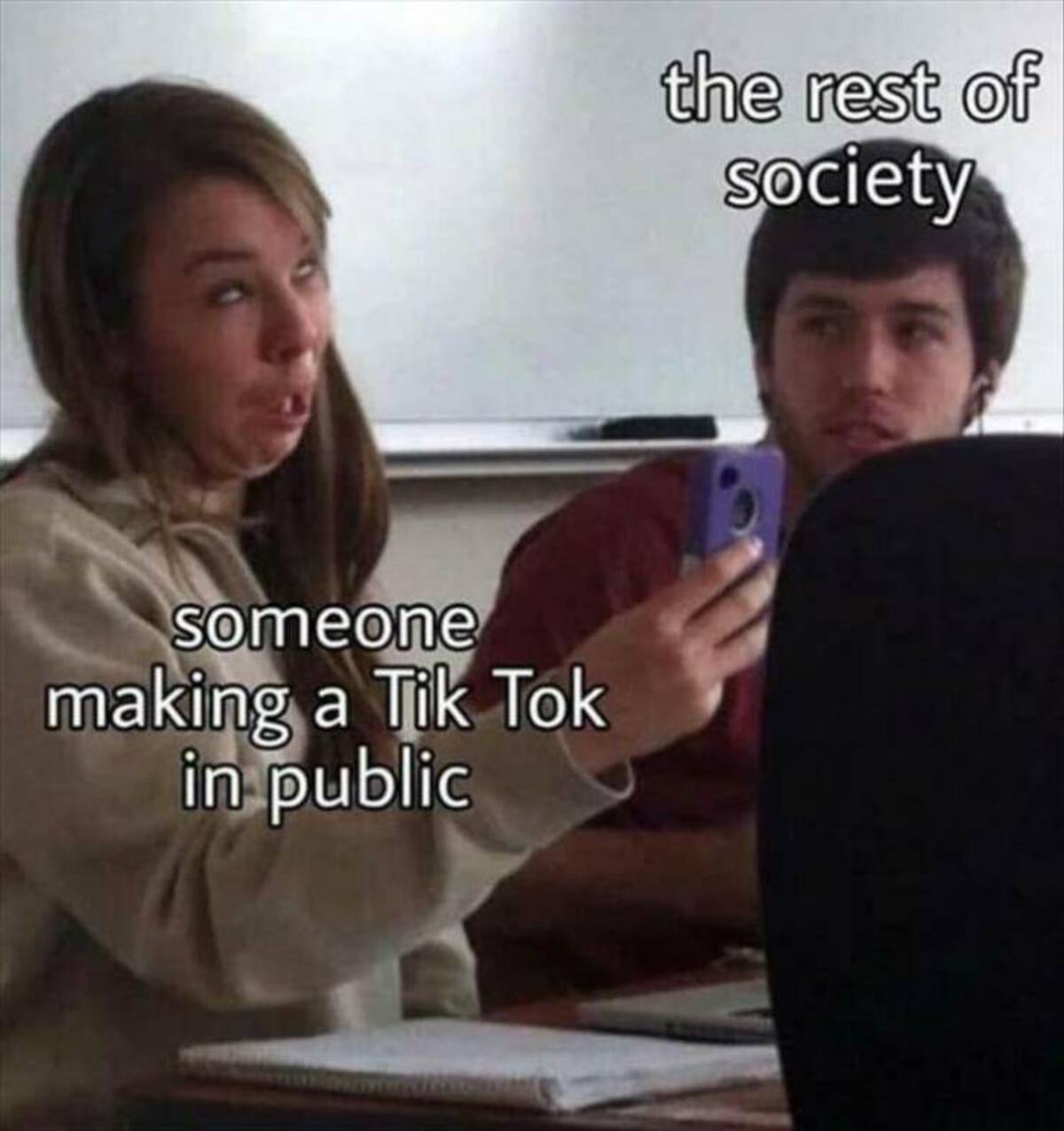 someone making a Tik Tok in public the rest of Society