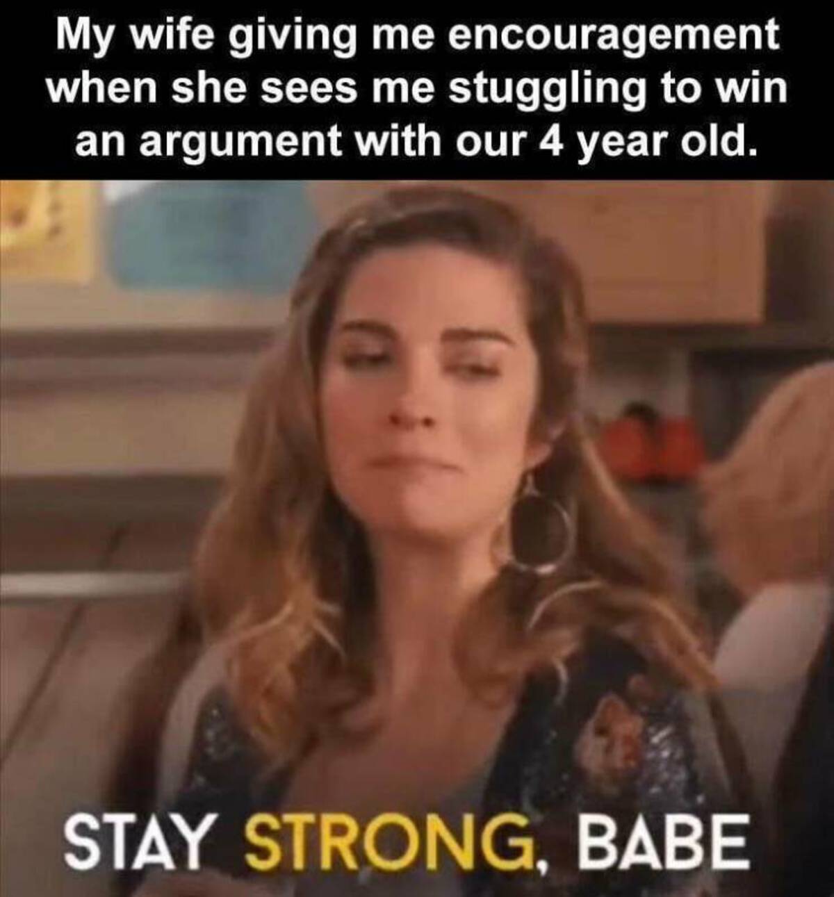 photo caption - My wife giving me encouragement when she sees me stuggling to win an argument with our 4 year old. Stay Strong, Babe