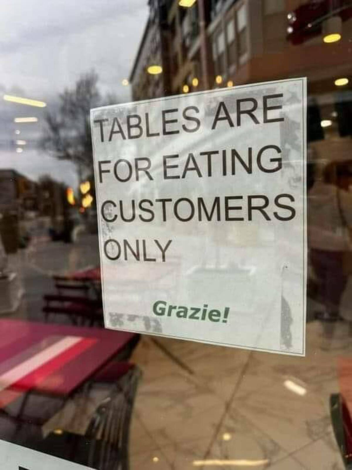 street sign - Tables Are For Eating Customers Only Grazie!