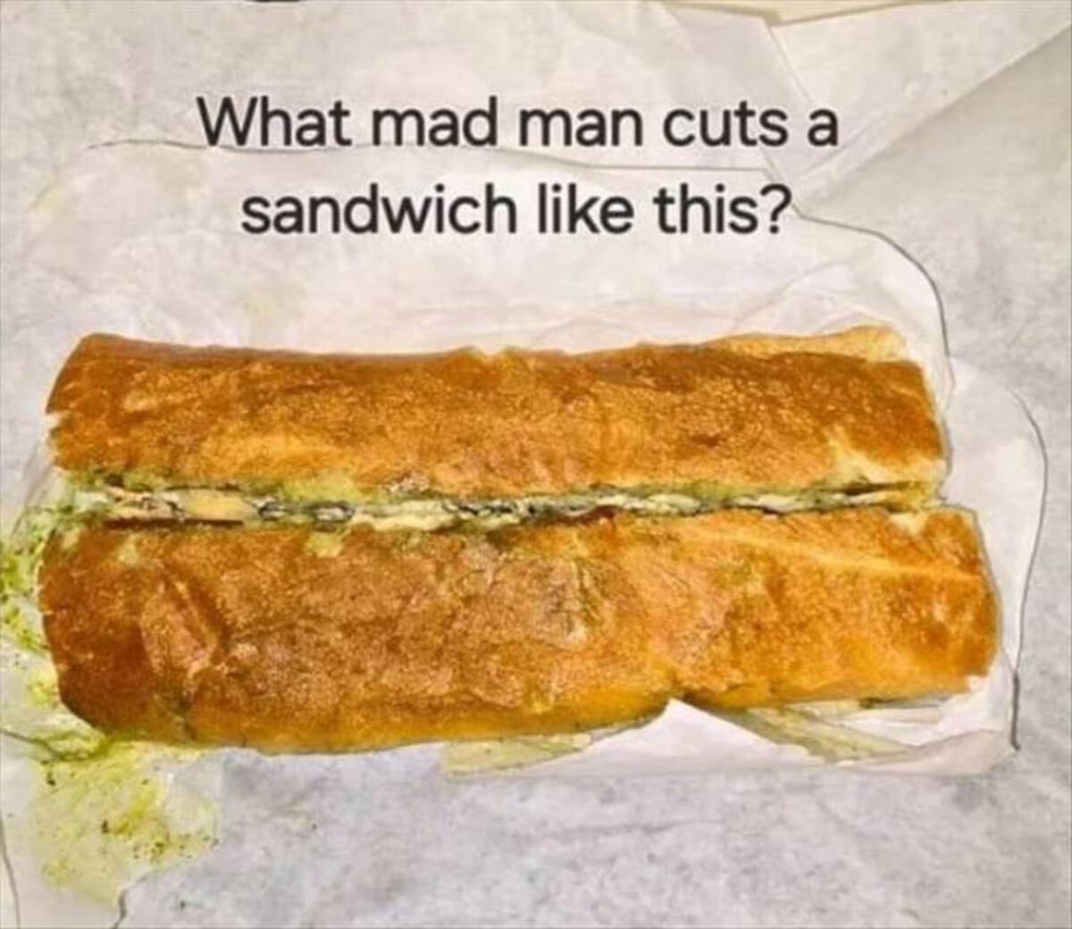 garlic bread - What mad man cuts a sandwich this?