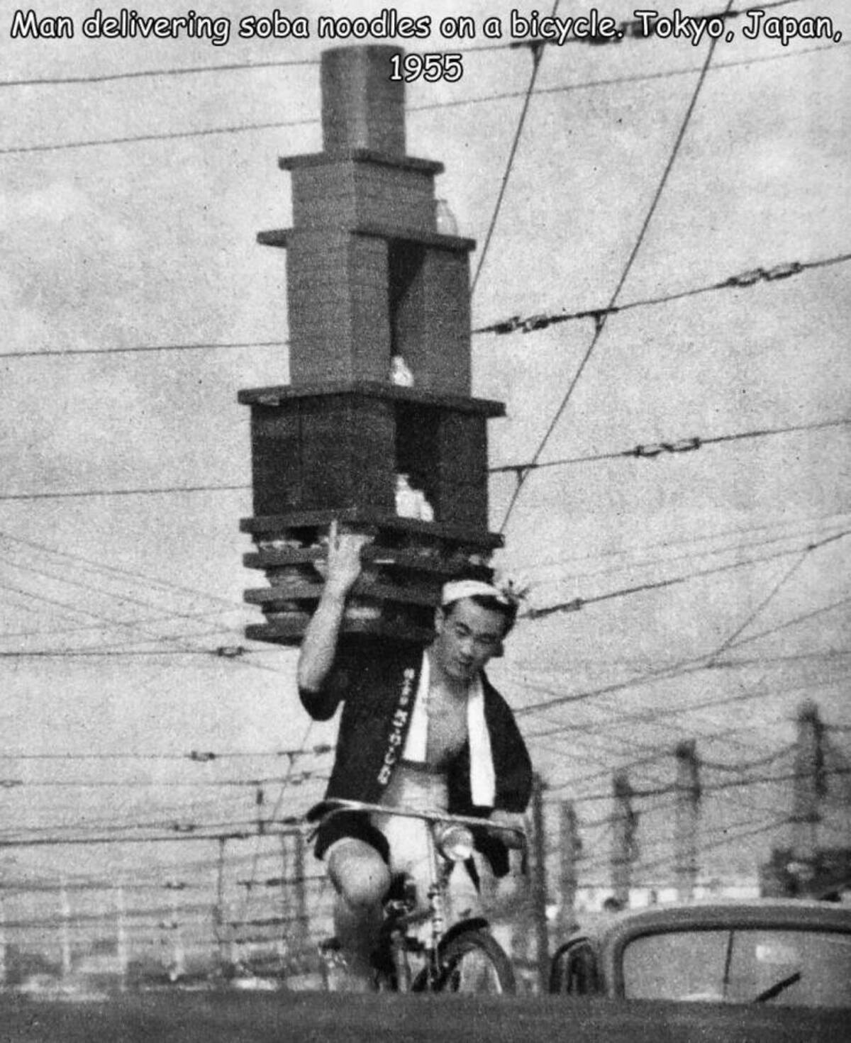 Man delivering soba noodles on a bicycle, Tokyo, Japan, 1955