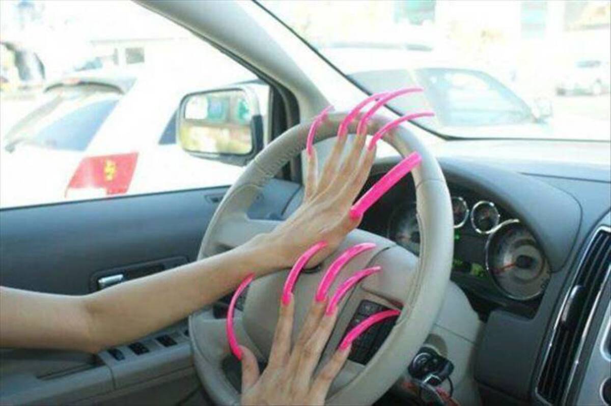 women driving with long nails