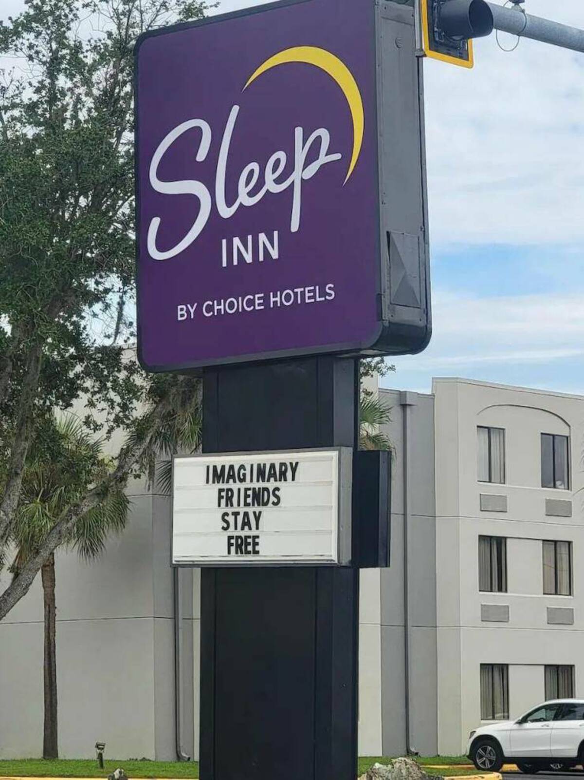 street sign - Sleep Inn By Choice Hotels Imaginary Friends Stay Free