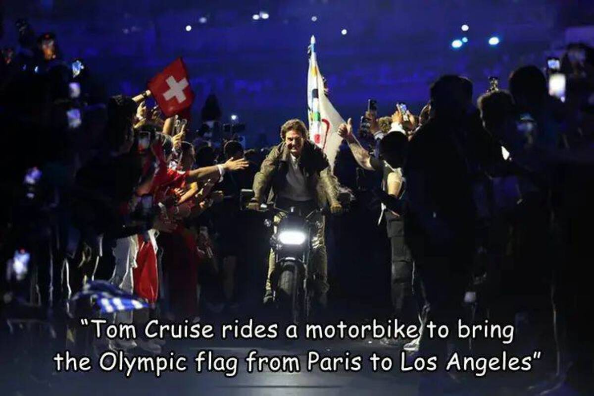 Tom Cruise - "Tom Cruise rides a motorbike to bring the Olympic flag from Paris to Los Angeles"