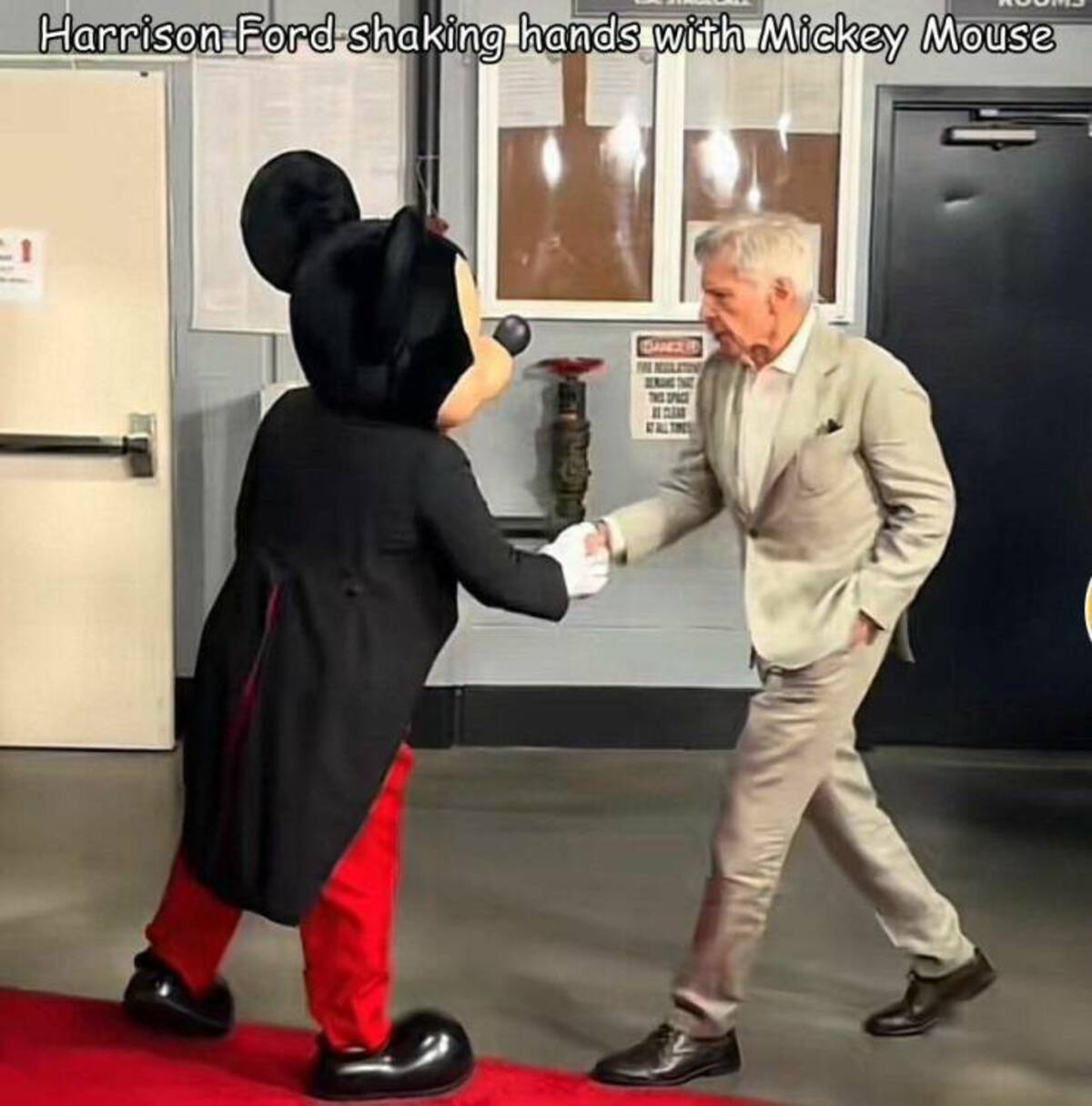 Mickey Mouse - Harrison Ford shaking hands with Mickey Mouse The Space