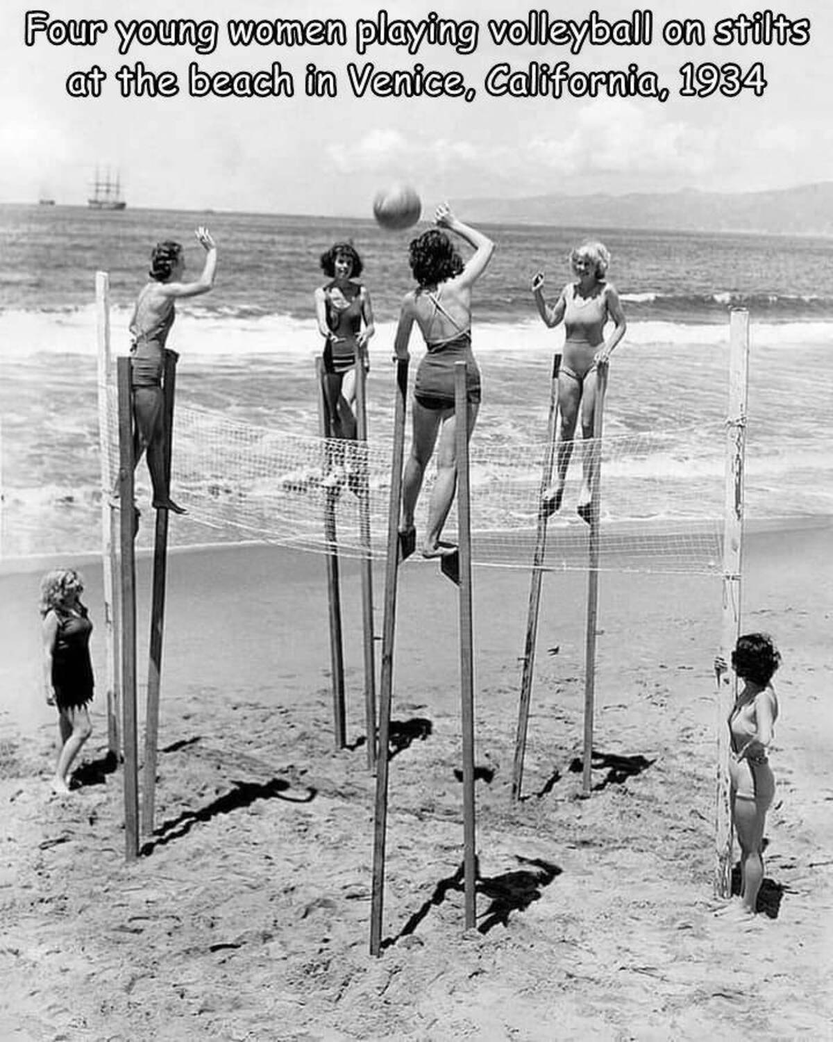 vintage beach volleyball - Four young women playing volleyball on stilts at the beach in Venice, California, 1934