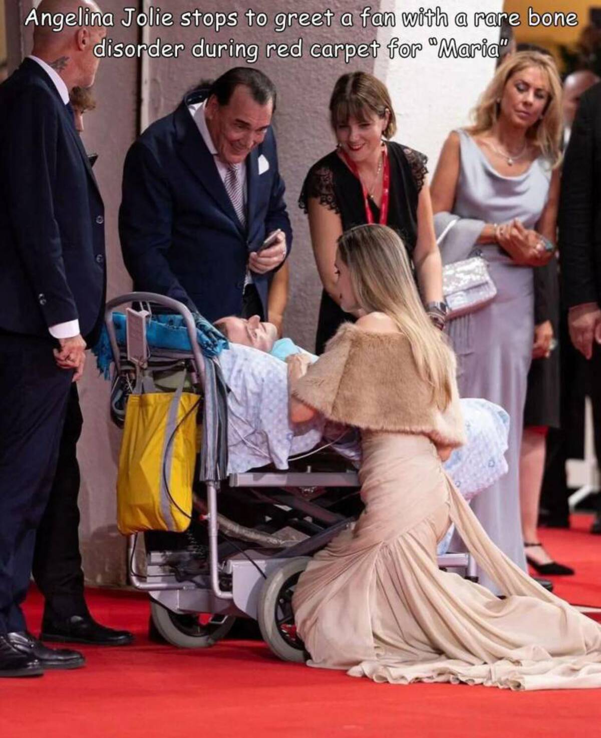 Angelina Jolie - Angelina Jolie stops to greet a fan with a rare bone disorder during red carpet for "Maria"