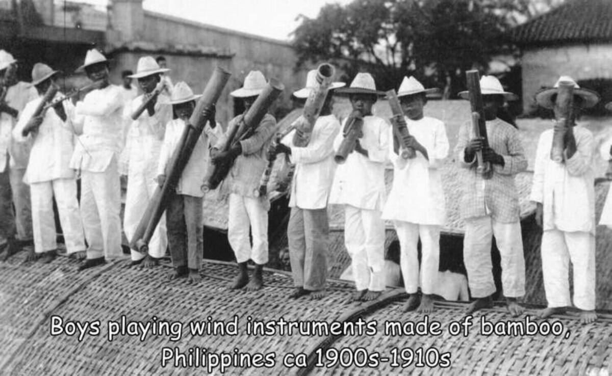 monochrome - Boys playing wind instruments made of bamboo, Philippines ca 1900s1910s