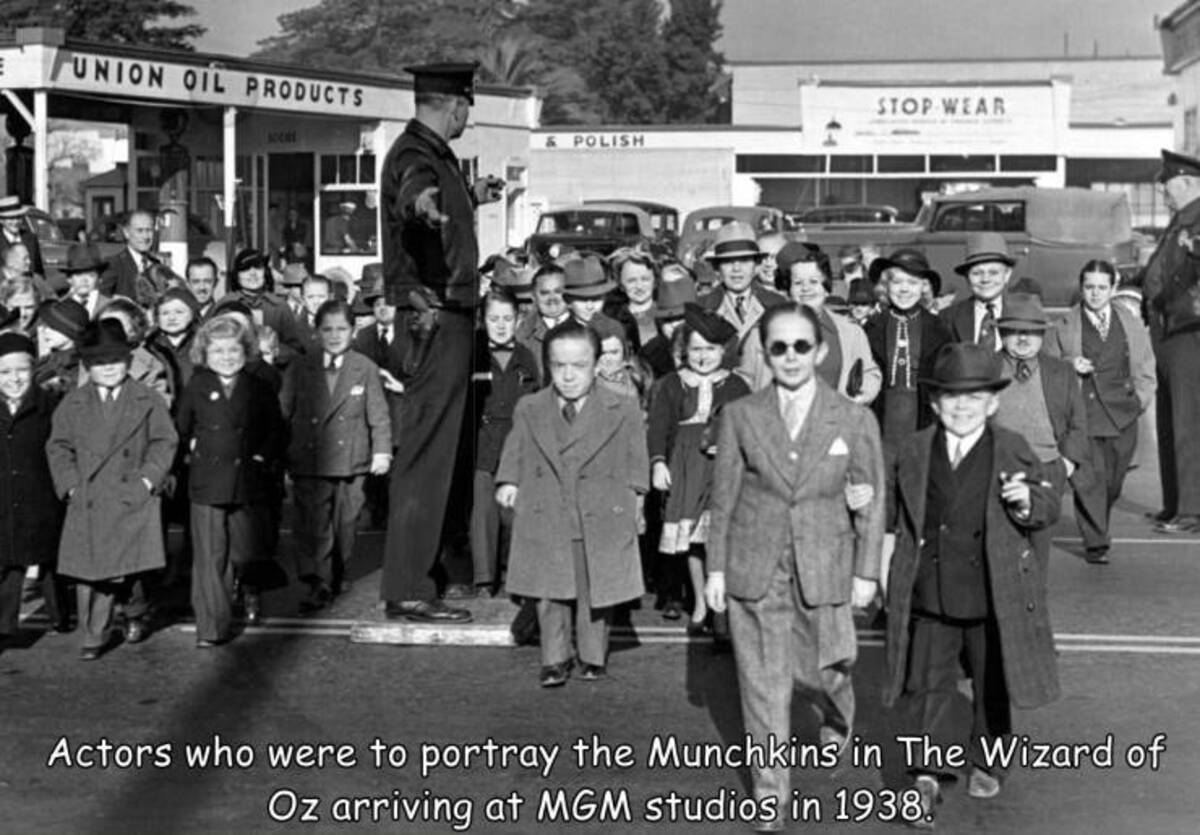 monochrome - E Union Oil Products Stop Wear & Polish Actors who were to portray the Munchkins in The Wizard of Oz arriving at Mgm studios in 1938.