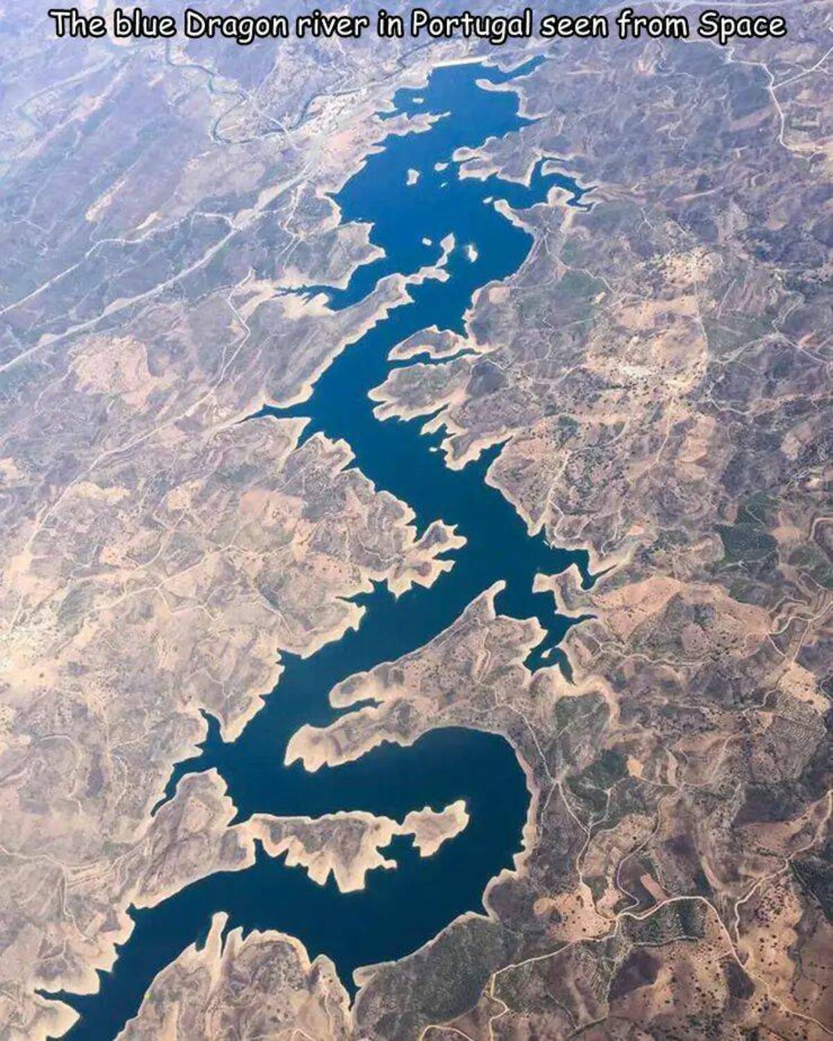 blue dragon river from space - The blue Dragon river in Portugal seen from Space