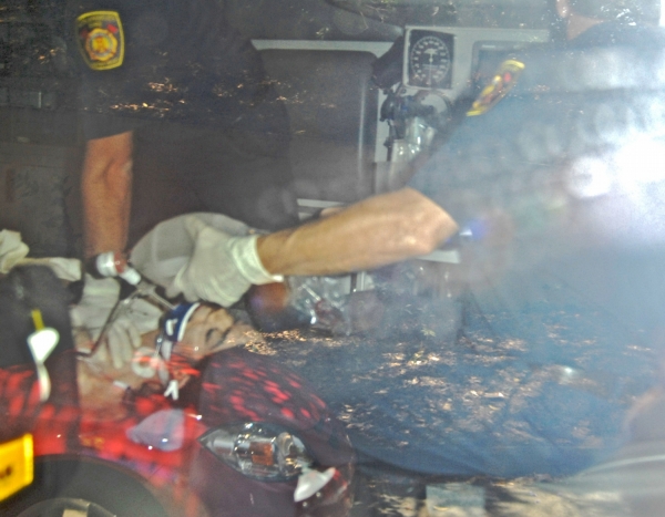 A photo of claiming to be MJ in an ambulance recieving CPR on way to hostpital.