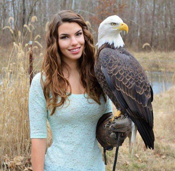 beautiful girl with bald eagle
