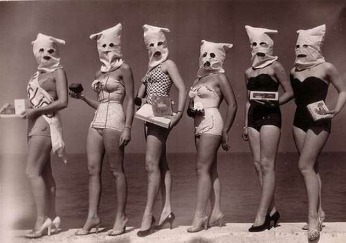 Beach beauty pageant contestants with scary bags on their heads
