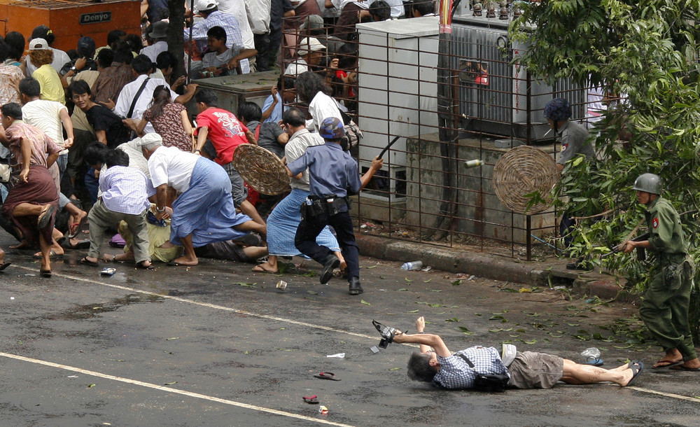 Japanese videographer, sprawled on the pavement, fatally wounded during a street demonstration in Myanmar, in Yangon's city centre September 27, 2007