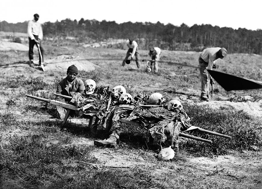 African Americans collect the remains of soldiers killed in battle near Cold Harbor, Virginia