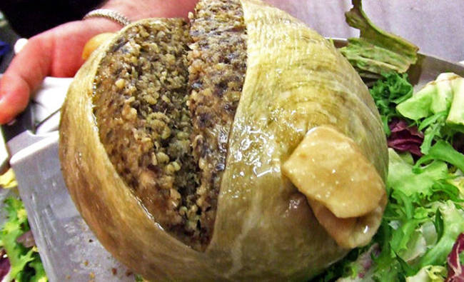 Haggis, Served in Scotland, this meal consists of sheep's stomach stuffed with sheep's liver, lungs and heart, onions, oatmeal, and various spices