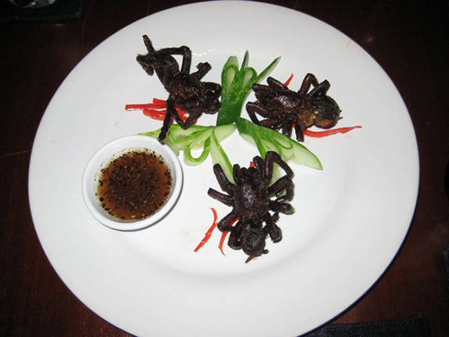 Deep Fried Trantula, Served in Cambodia, they supposedly taste like spare ribs and include the eggs and excrement inside