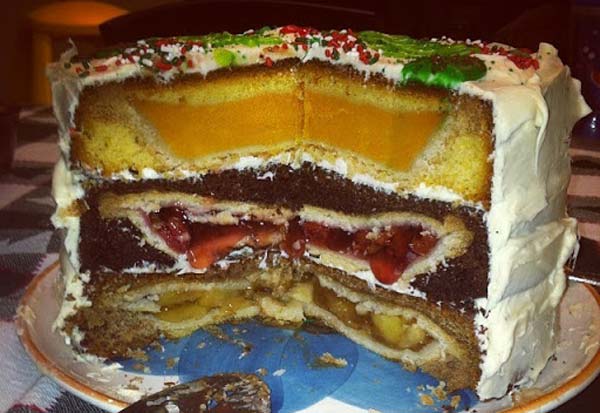 The cherpumple, apple, cherry and pumpkin pie inside of a cake