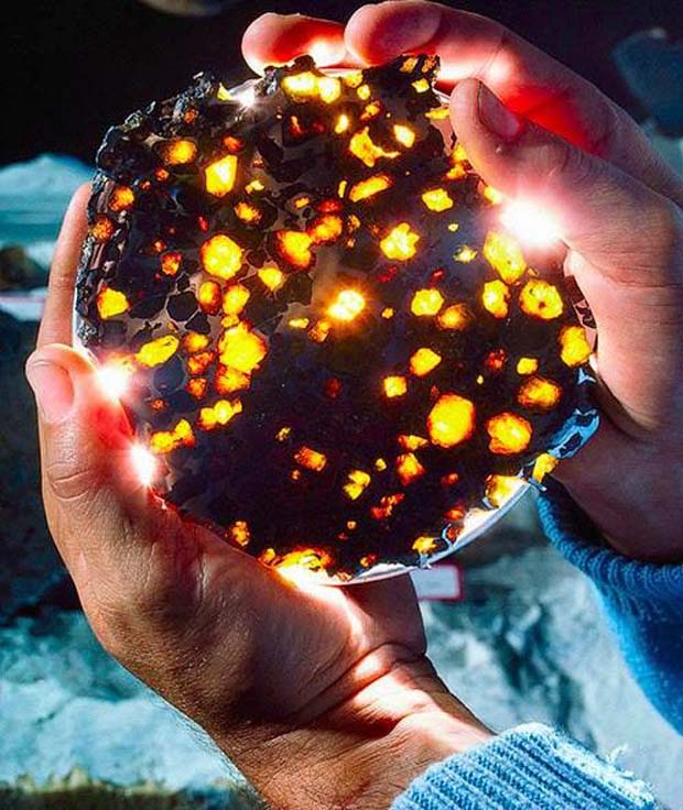 From a Violent Collision Comes Celestial Beauty - Amber inclusions of olivine in meteorite
