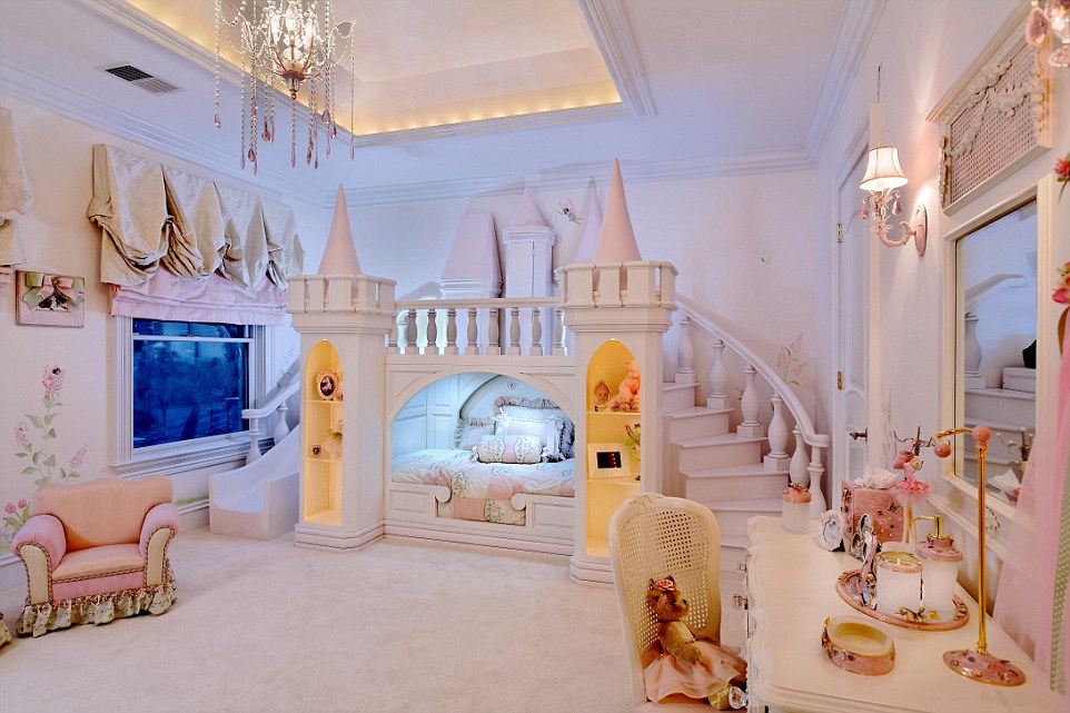 An enchanting room was created with a custom-made castle bed with hidden storage for her dolls.
