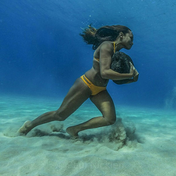 surfer running on ocean floor