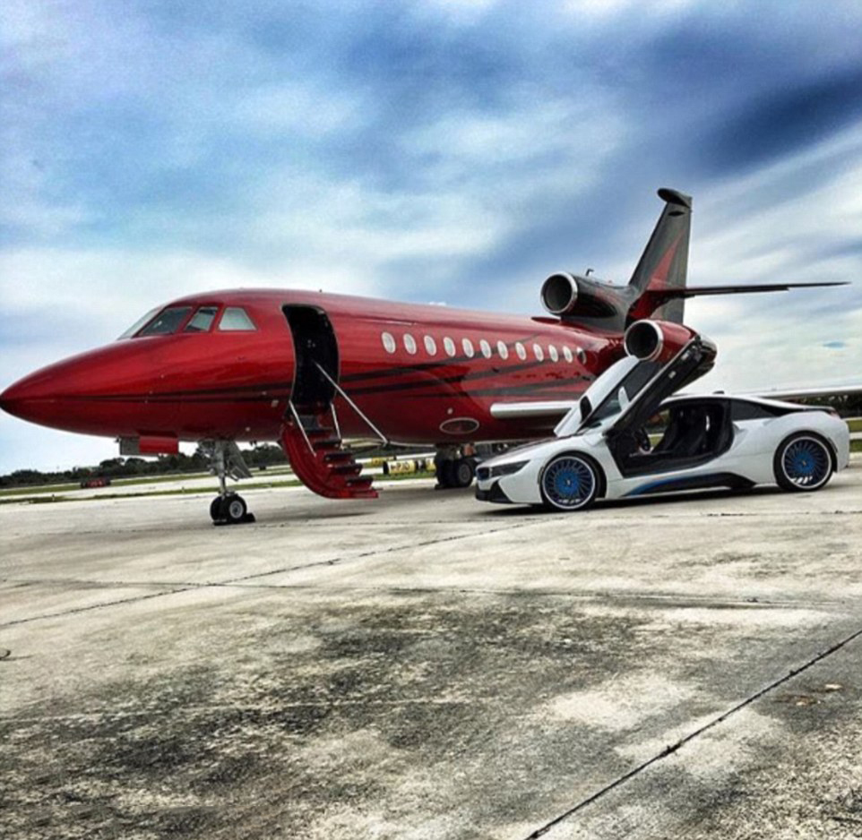 How the super rich travel: A photo shows a super car parked next to a private jet on the runway
