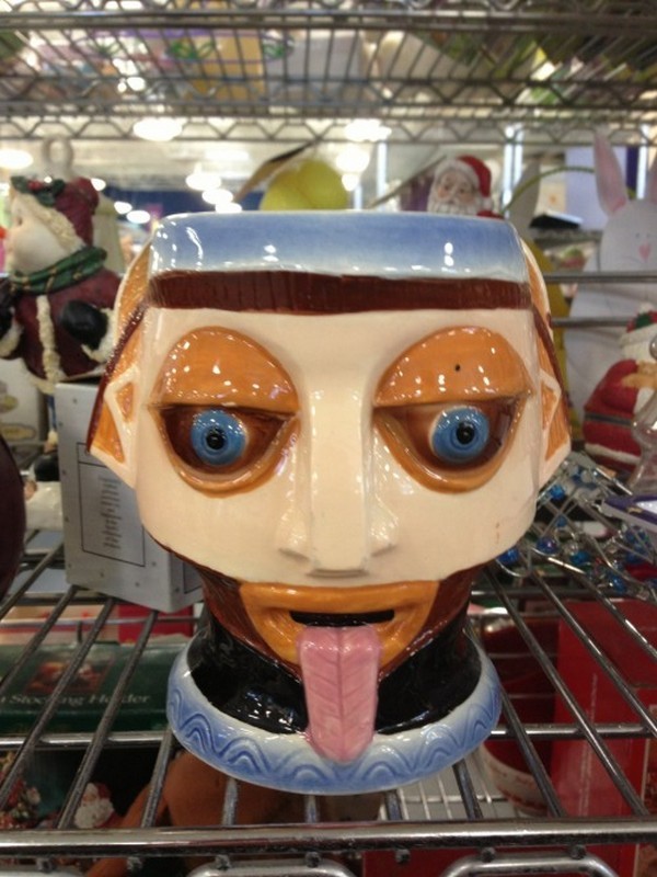 Creepy thrift shop find of container with face