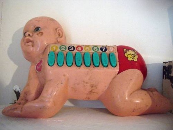 Scary find from a thrift shop of creepy baby doll with musical buttons