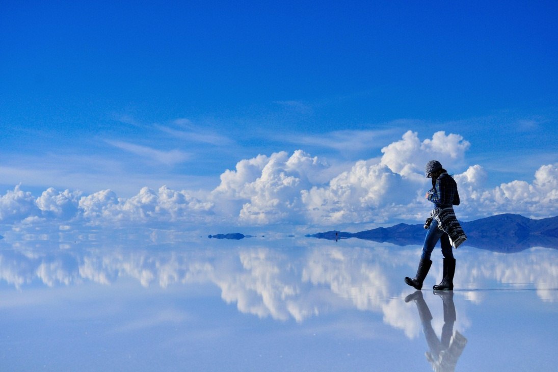 The ski gets reflected by the perfect surface of this salt flat located in Bolivia