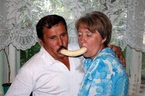 Old couple eating a banana from both ends