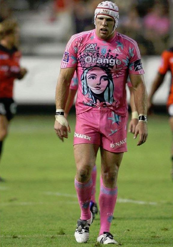 Tough looking rugby player dressed all in pink