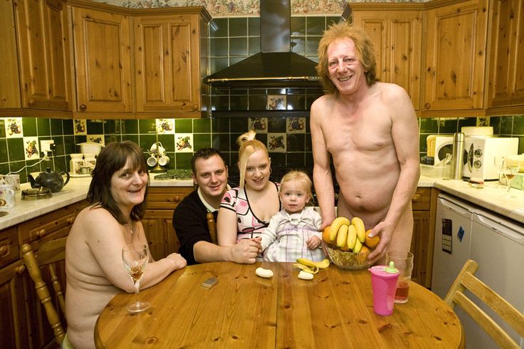 Family photo in the kitchen, and mom and dad are naked, but tastefully.