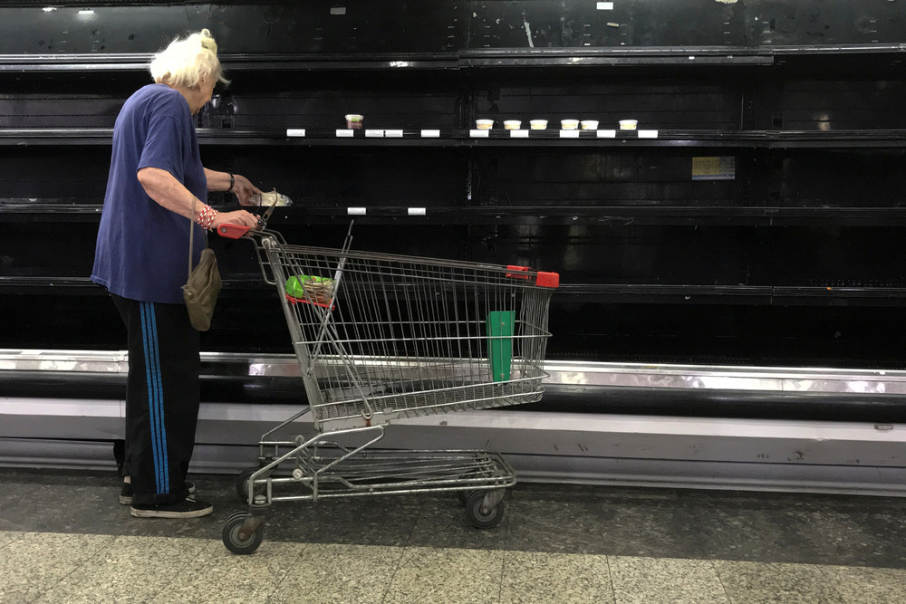 fascinating photos - woman by empty shelves