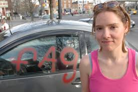 Erin's car was vandalized, left with the words "fag" and "u r gay" placed on the driver's side window and hood of her car.