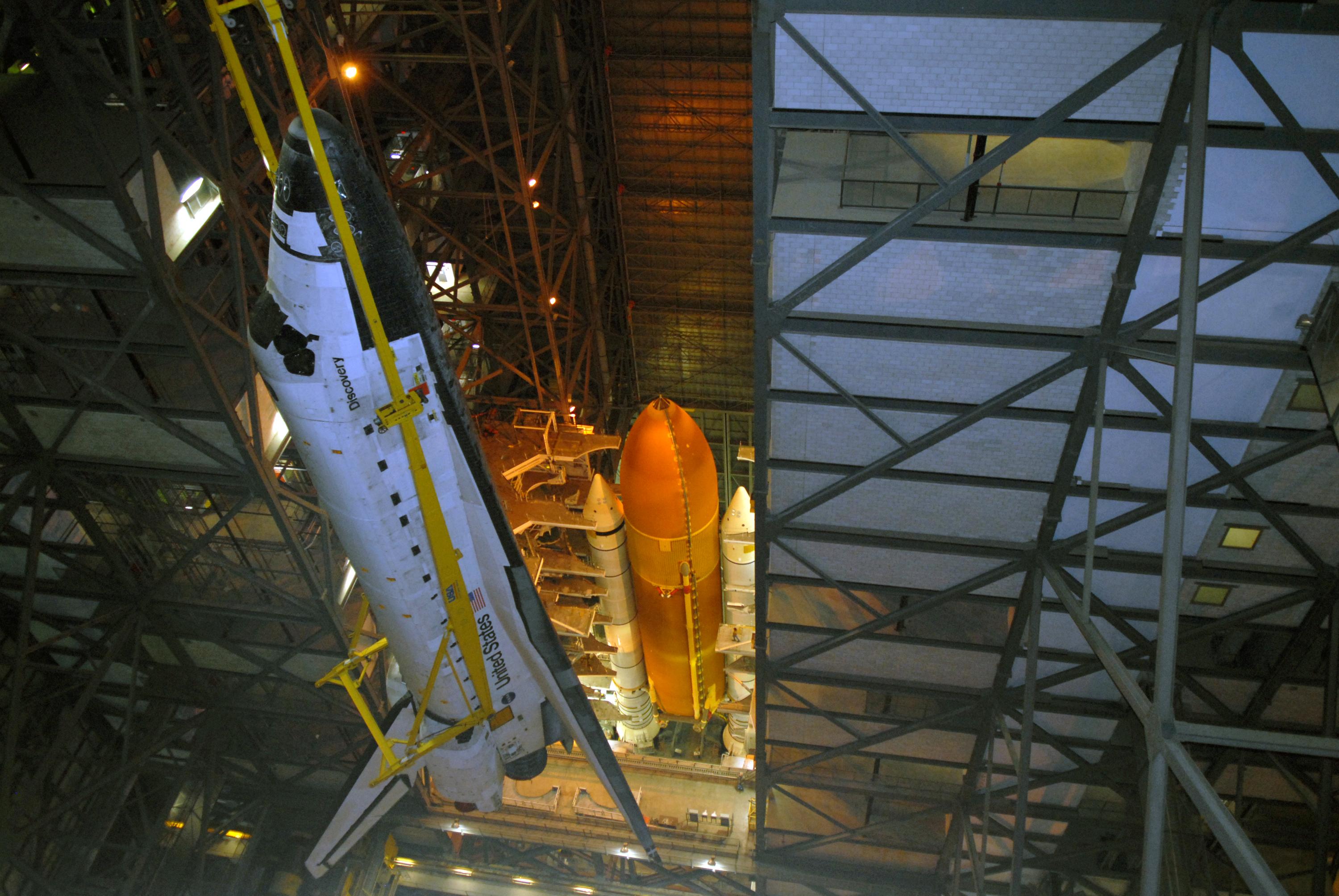 Picture of a space shuttle being prepared for launch.