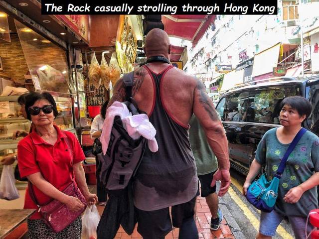 funny picture of The Rock casually strolling through Hong Kong