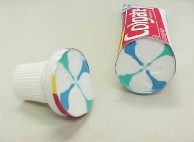 Toothpaste container cut in half.