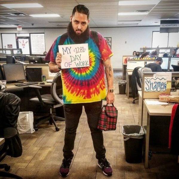 random photo of someone's 1281 day at work wearing a tie-dyed shirt and robust beard