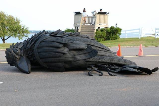 random photo of sculpture made from old tires of what appears to be a dead bird