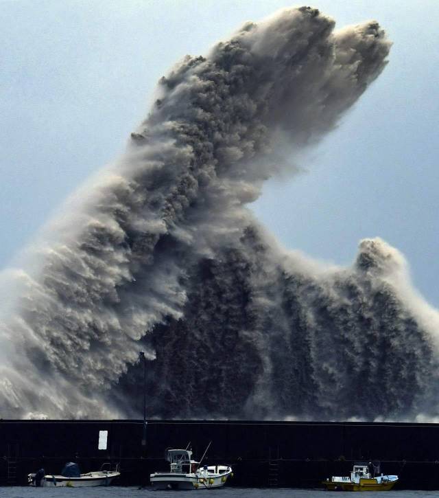 random photos of a wave crashing and making big splash