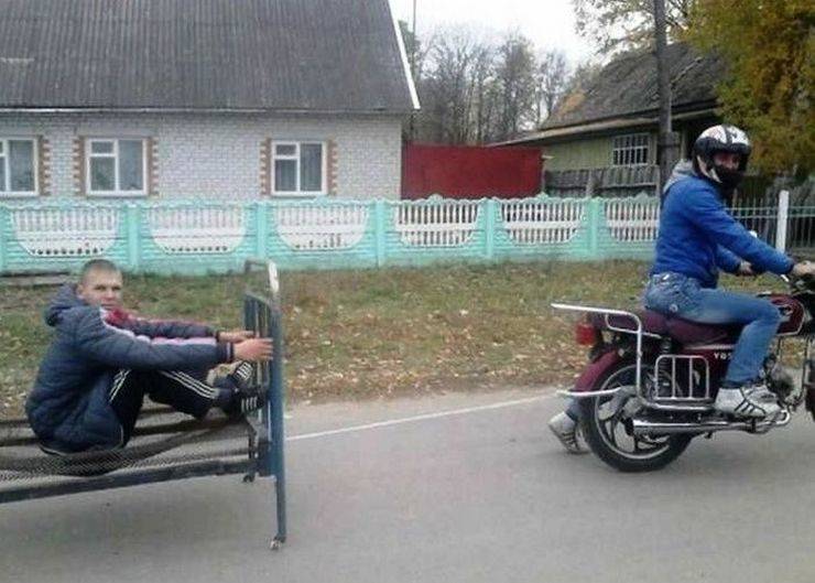 Cursed image of Russian kid on a bed frame being pulled by a motorcycle