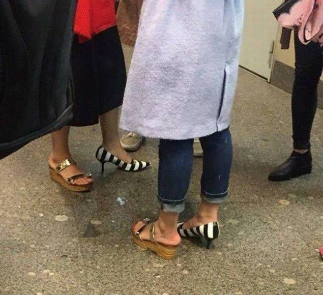 Cursed image of two woman who have swapped one shoe