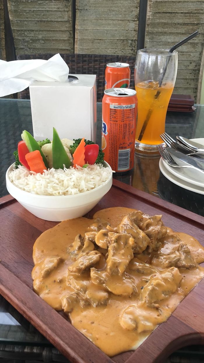 curry chicken and rice on a chopping board