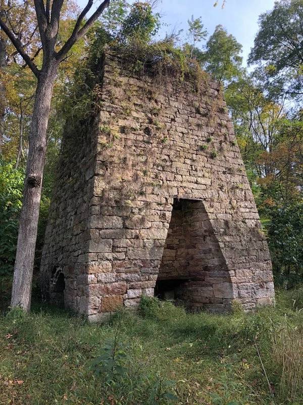 "Near the side of the road in West Virginia, three sides of it have those room things."A: "It looks more like an iron furnace."